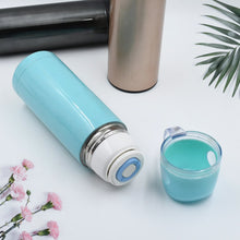 Stainless steel vacuum bottle with cup lid.