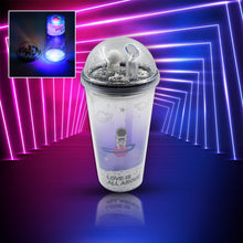 Astronaut-themed tumbler with straw and LED glow