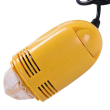 Handy mini vacuum cleaner for quick dust removal from electronic devices.